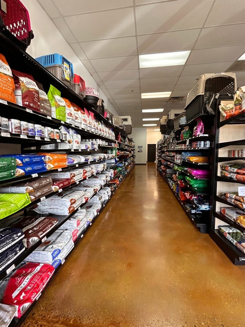 An aisle of Fromm and other premium food bags